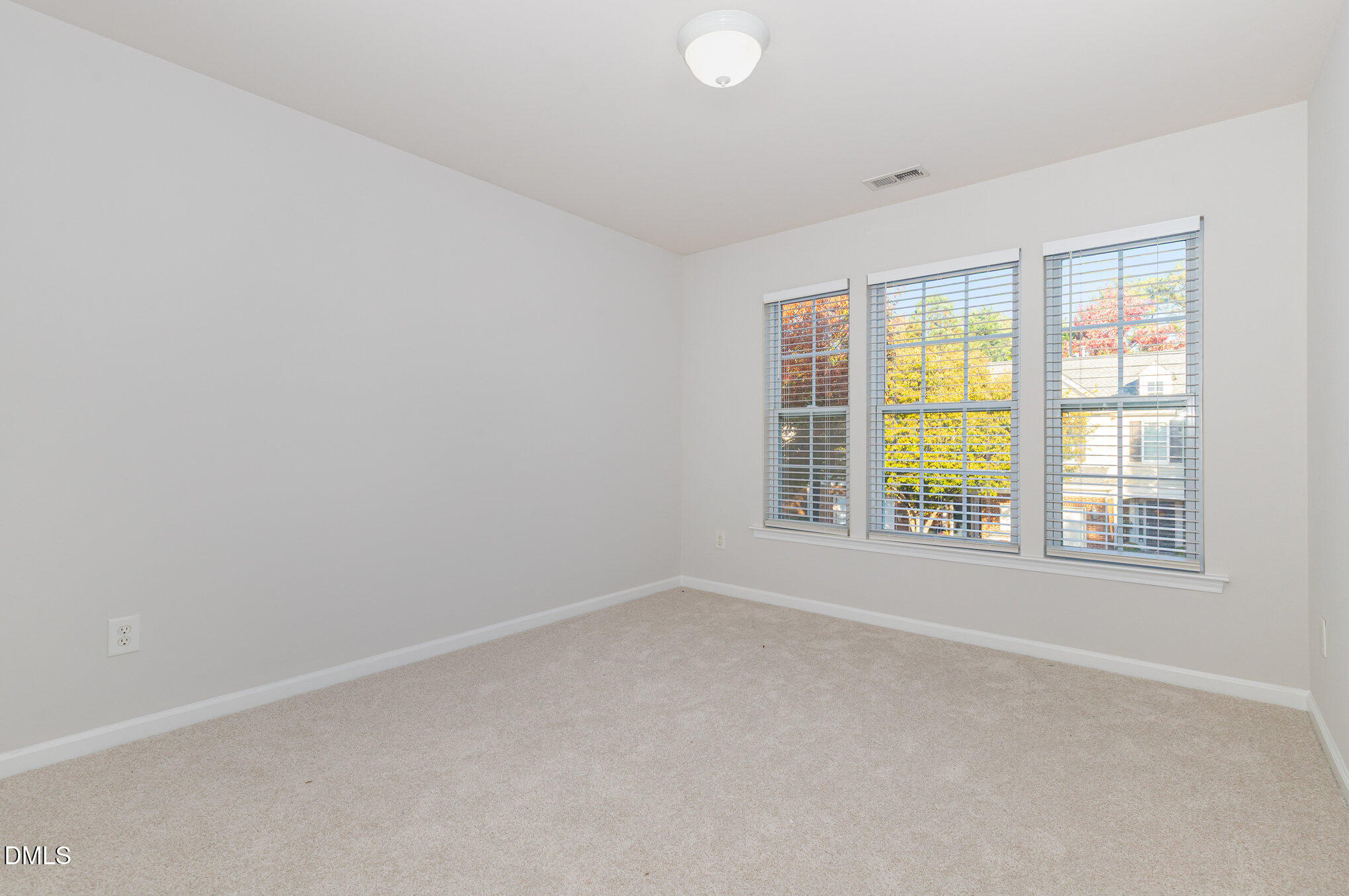 8325 Pilots View Drive Raleigh, NC 27617 - Photo 23 of 28 an empty room with a window