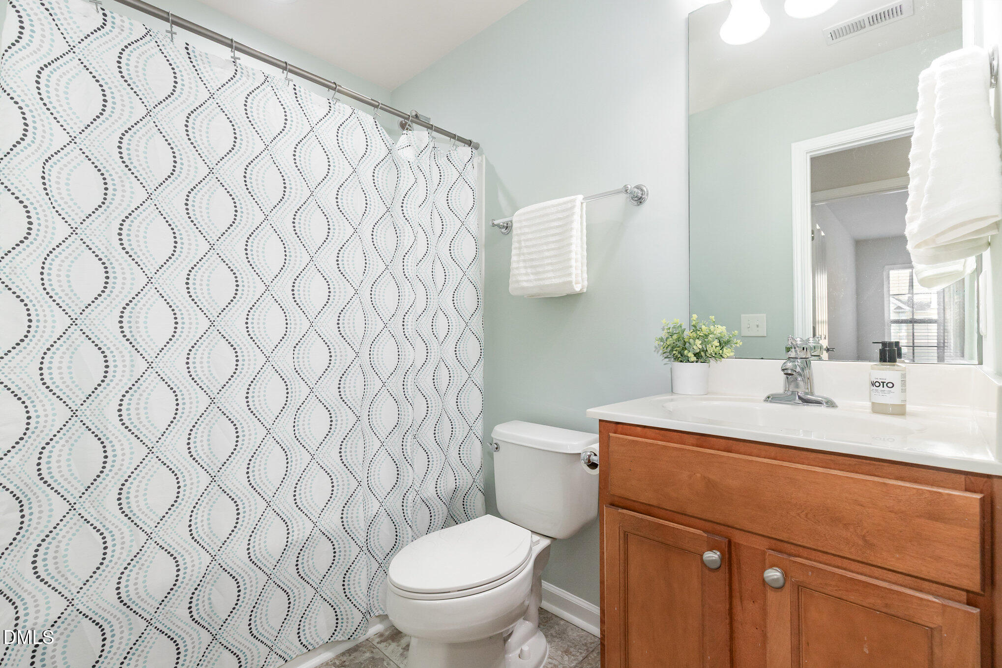 8325 Pilots View Drive Raleigh, NC 27617 - Photo 24 of 28 a bathroom with a sink and a toilet