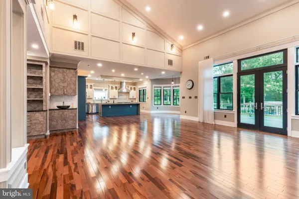 a kitchen with stainless steel appliances granite countertop a sink a stove and a refrigerator