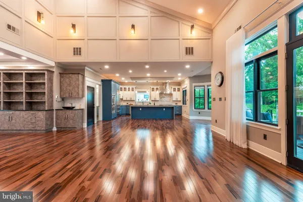 a kitchen with granite countertop a stove and cabinets