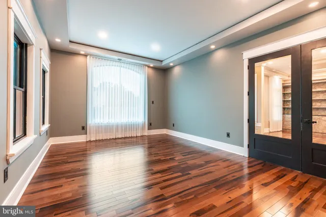 a spacious bathroom with a sink a mirror and a bathtub