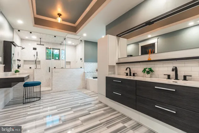 a view of a room with kitchen view and windows