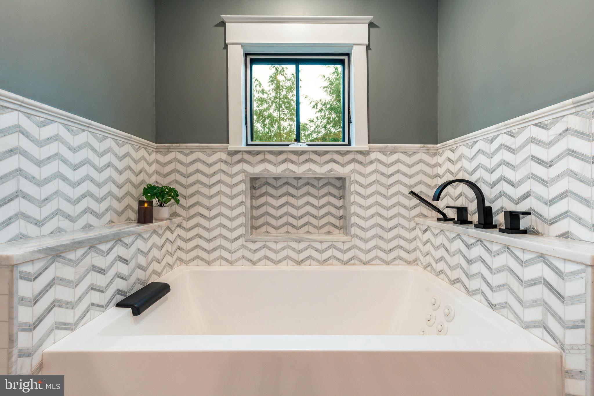 1226 Norwalk Road Philadelphia, PA 19115 - Photo 24 of 68 a bathroom with a bathtub and a window