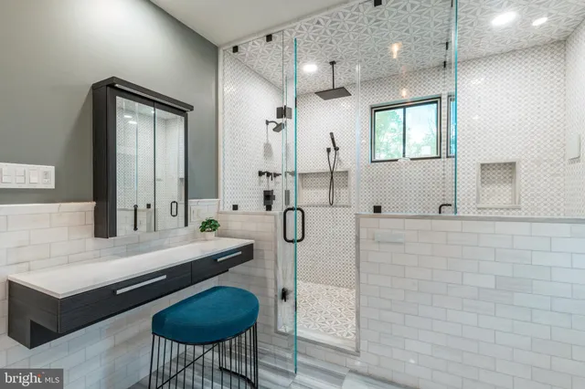 a view of empty room with wooden floor and fireplace