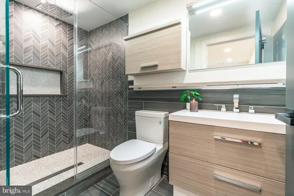 a view of a hallway view with wooden floor and staircase
