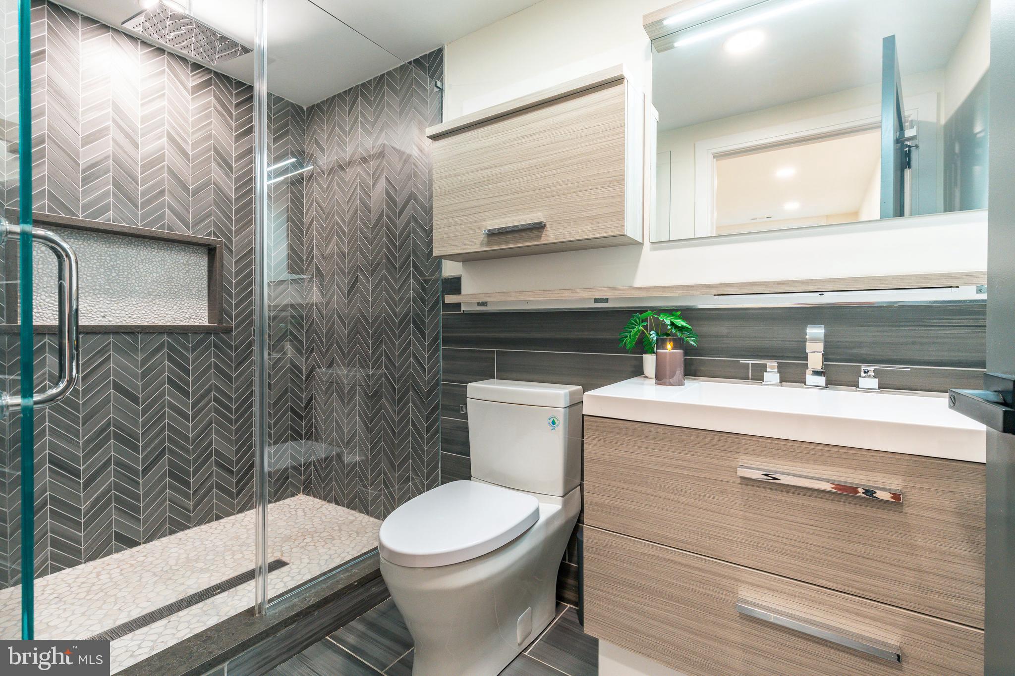 1226 Norwalk Road Philadelphia, PA 19115 - Photo 33 of 68 a bathroom with a sink a toilet and shower