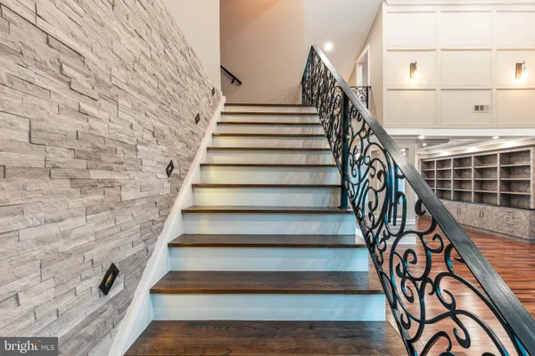 a view of a patio with couches table and chairs and potted plants