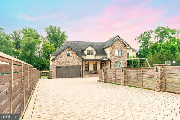 a front view of a house with glass windows
