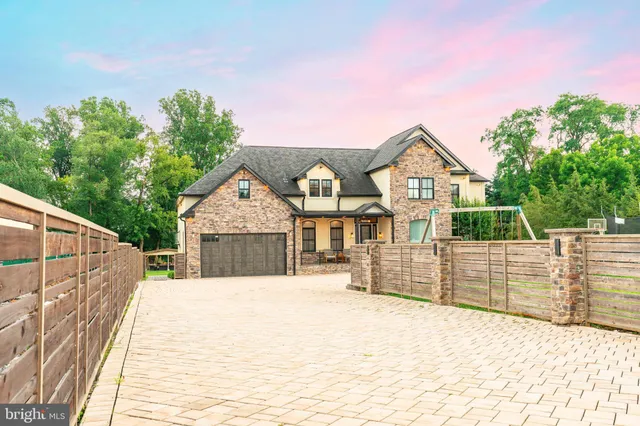 a front view of a house with glass windows