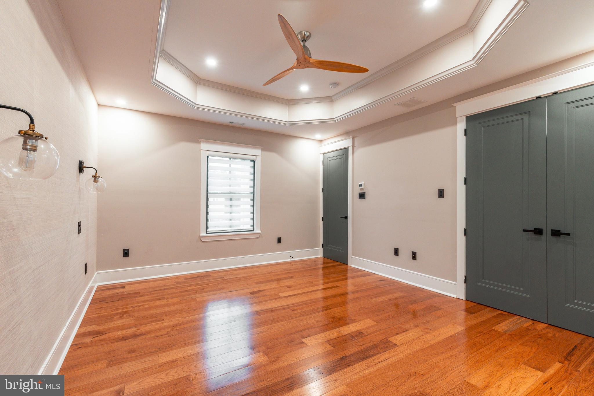 1226 Norwalk Road Philadelphia, PA 19115 - Photo 42 of 68 a view of an empty room with window and wooden floor