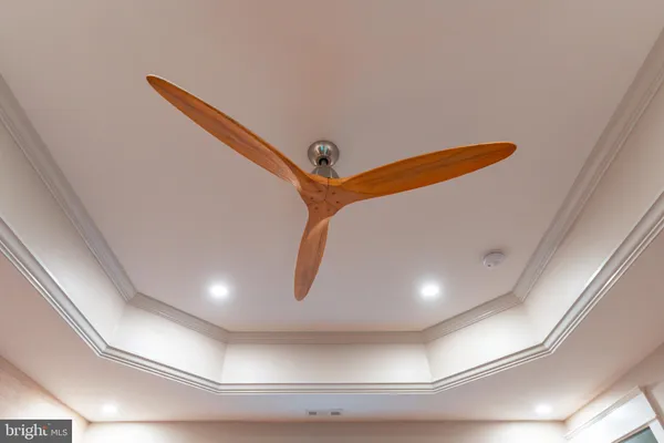 a view of a brick house with large windows and a table