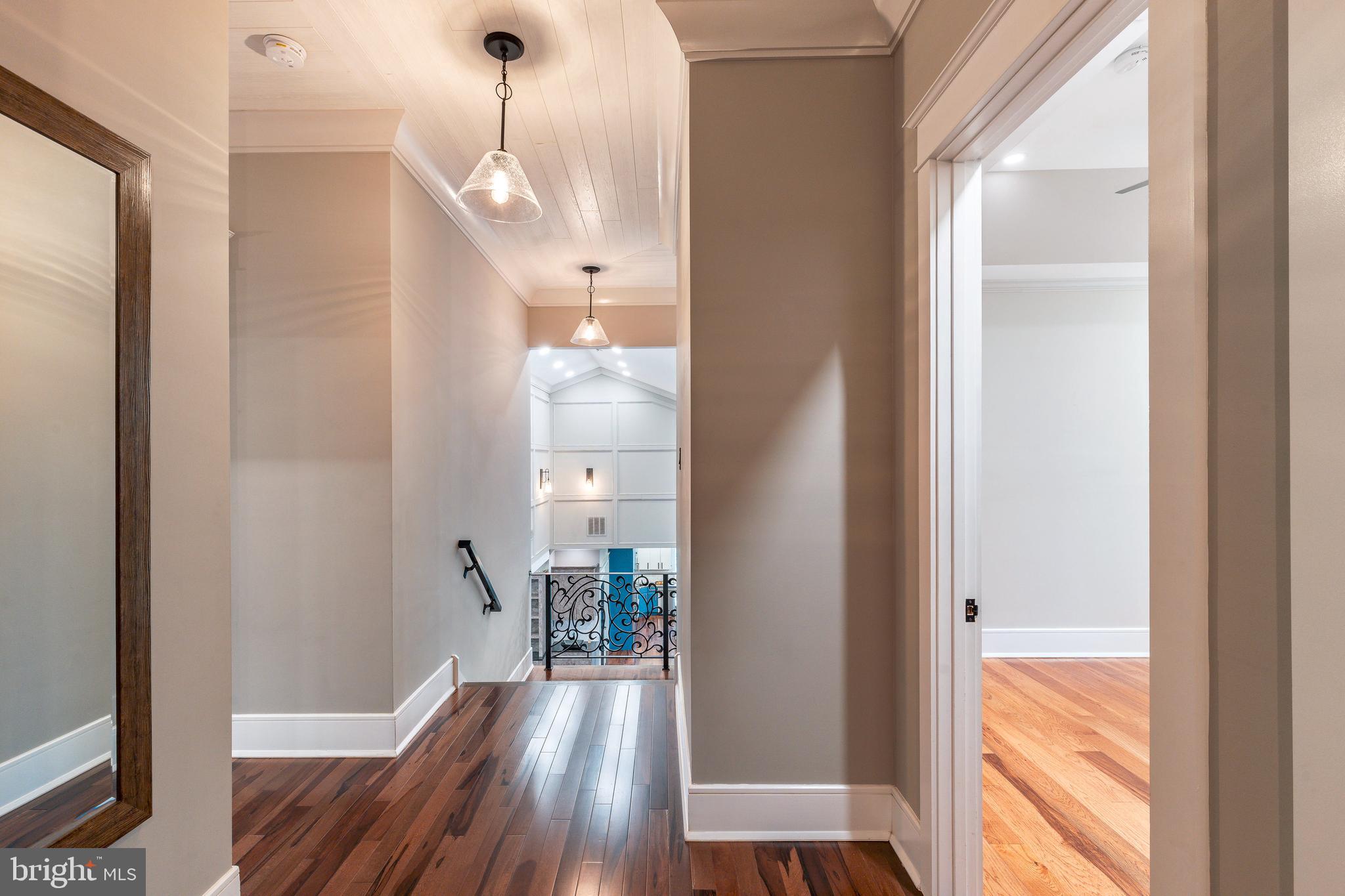 1226 Norwalk Road Philadelphia, PA 19115 - Photo 46 of 68 a view of a hallway view with wooden floor and staircase