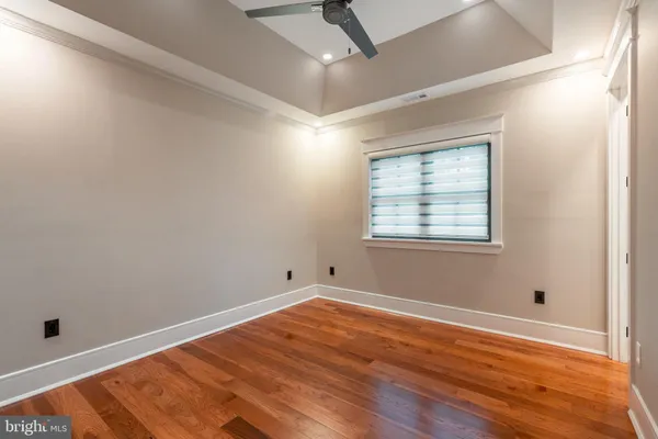 a living room with furniture and floor to ceiling window