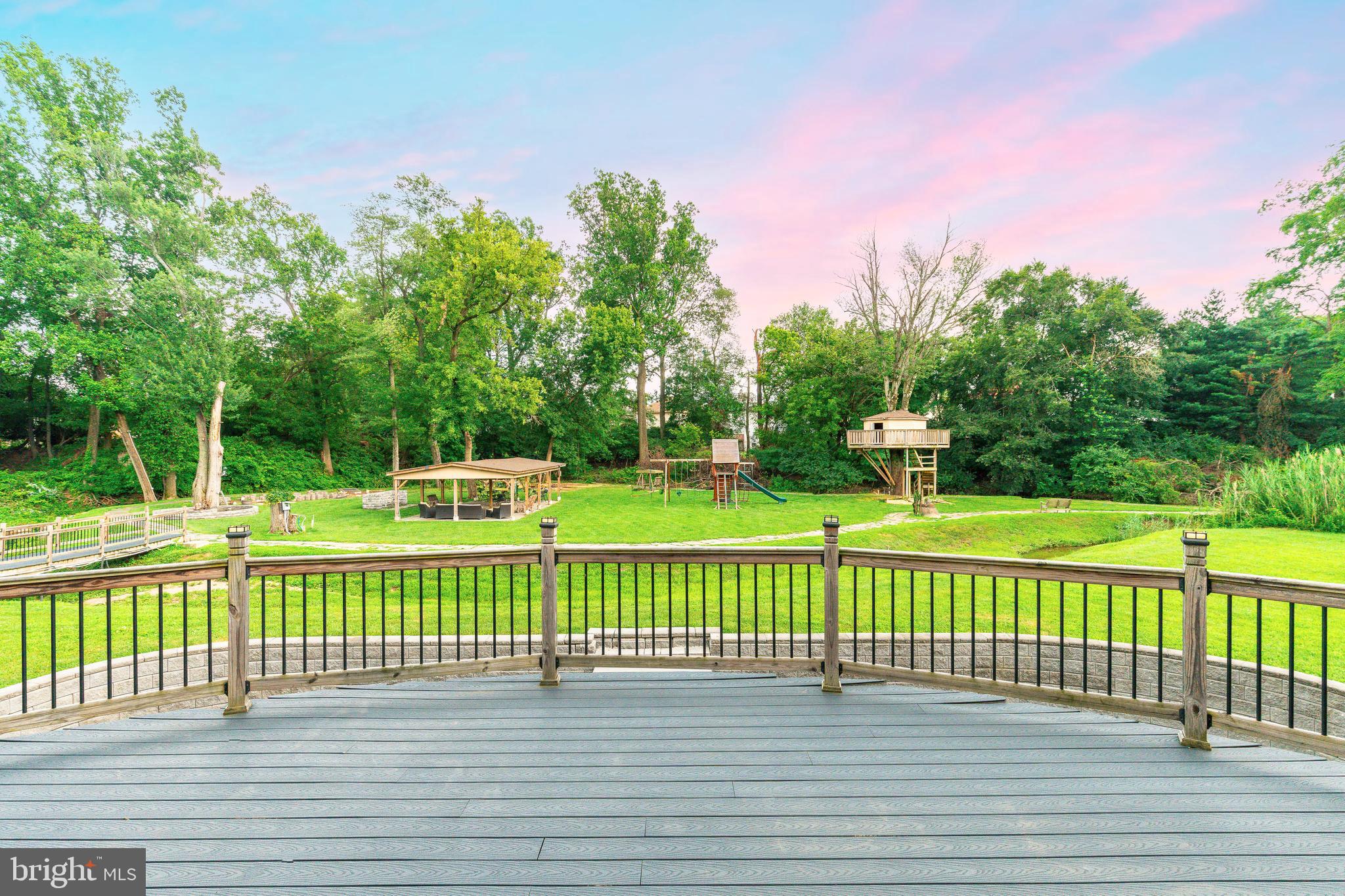 1226 Norwalk Road Philadelphia, PA 19115 - Photo 55 of 68 a park view with a bench in a garden