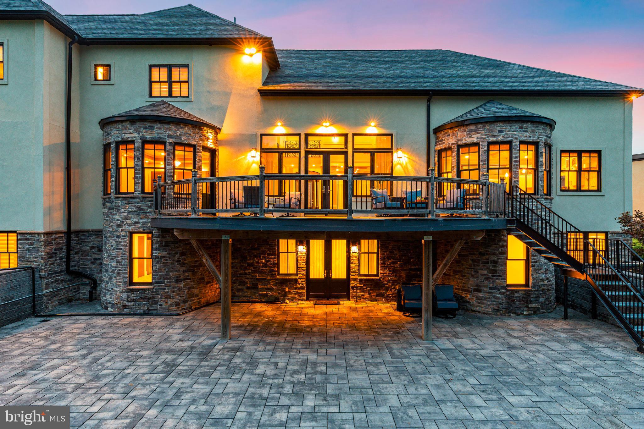 1226 Norwalk Road Philadelphia, PA 19115 - Photo 60 of 68 a view of a brick house with large windows and a table
