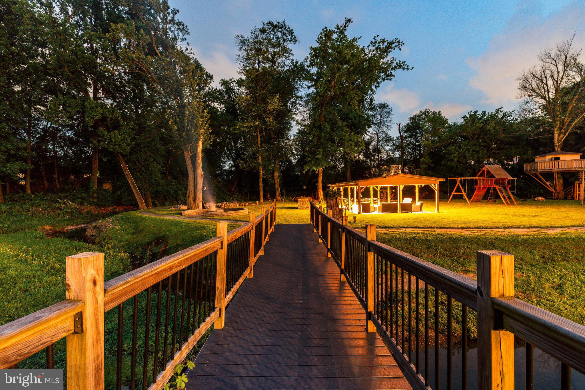 1226 Norwalk Road Philadelphia, PA 19115 - Photo 63 of 68 a view of swimming pool with seating area and trees around