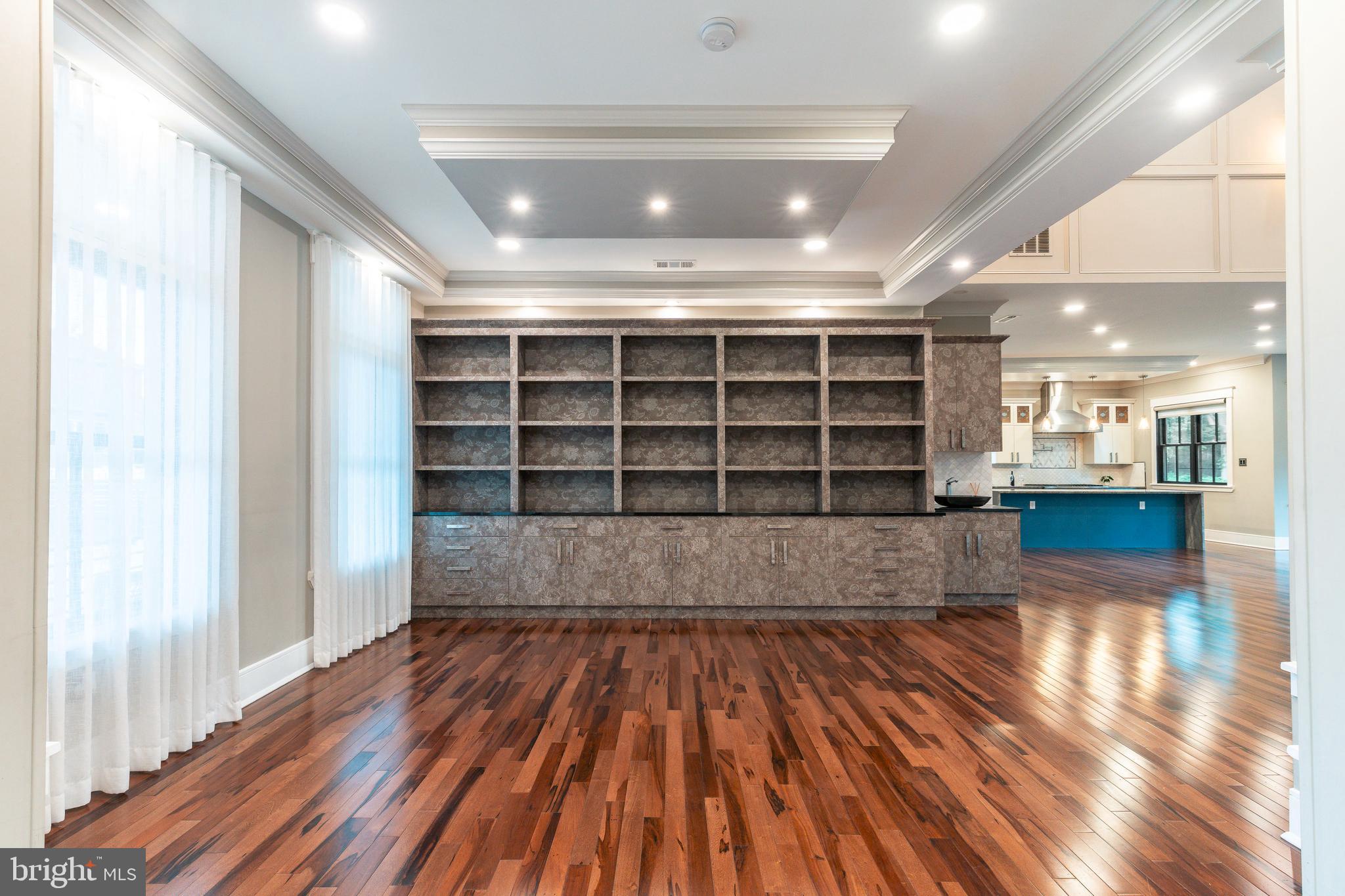 1226 Norwalk Road Philadelphia, PA 19115 - Photo 9 of 68 a view of an empty room with wooden floor and a window