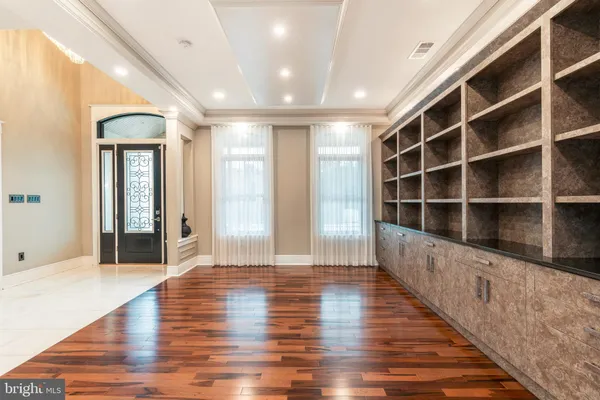 a view of a living room with wooden floor