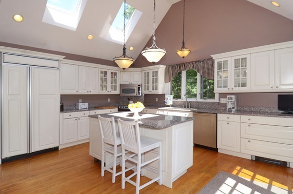 266 Ball Hill Road Princeton, MA 01541 - Photo 3 of 28 a kitchen with a stove a sink a dining table and chairs