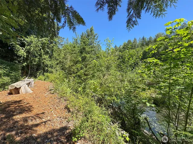a living room with furniture flat screen tv and a fireplace