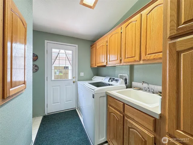 a living room with furniture gym equipment and a large window