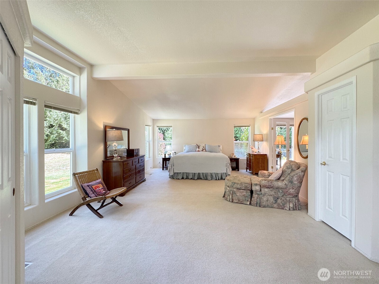 77 Rd Less Traveled Way Sequim, WA 98382 - Photo 24 of 40 a living room with furniture gym equipment and a large window