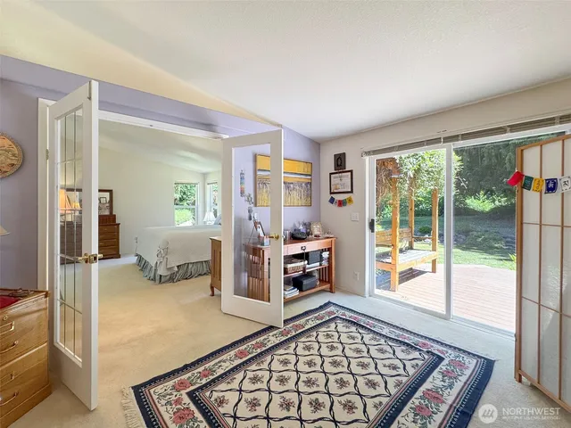 a view of walk in closet with clothes