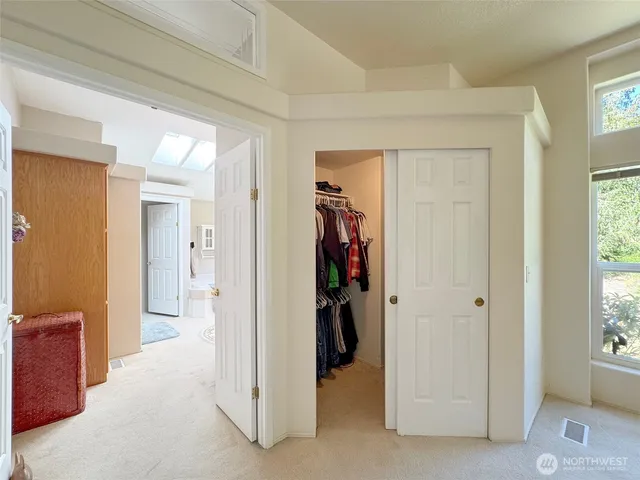 a spacious bathroom with a sink a toilet and a tub
