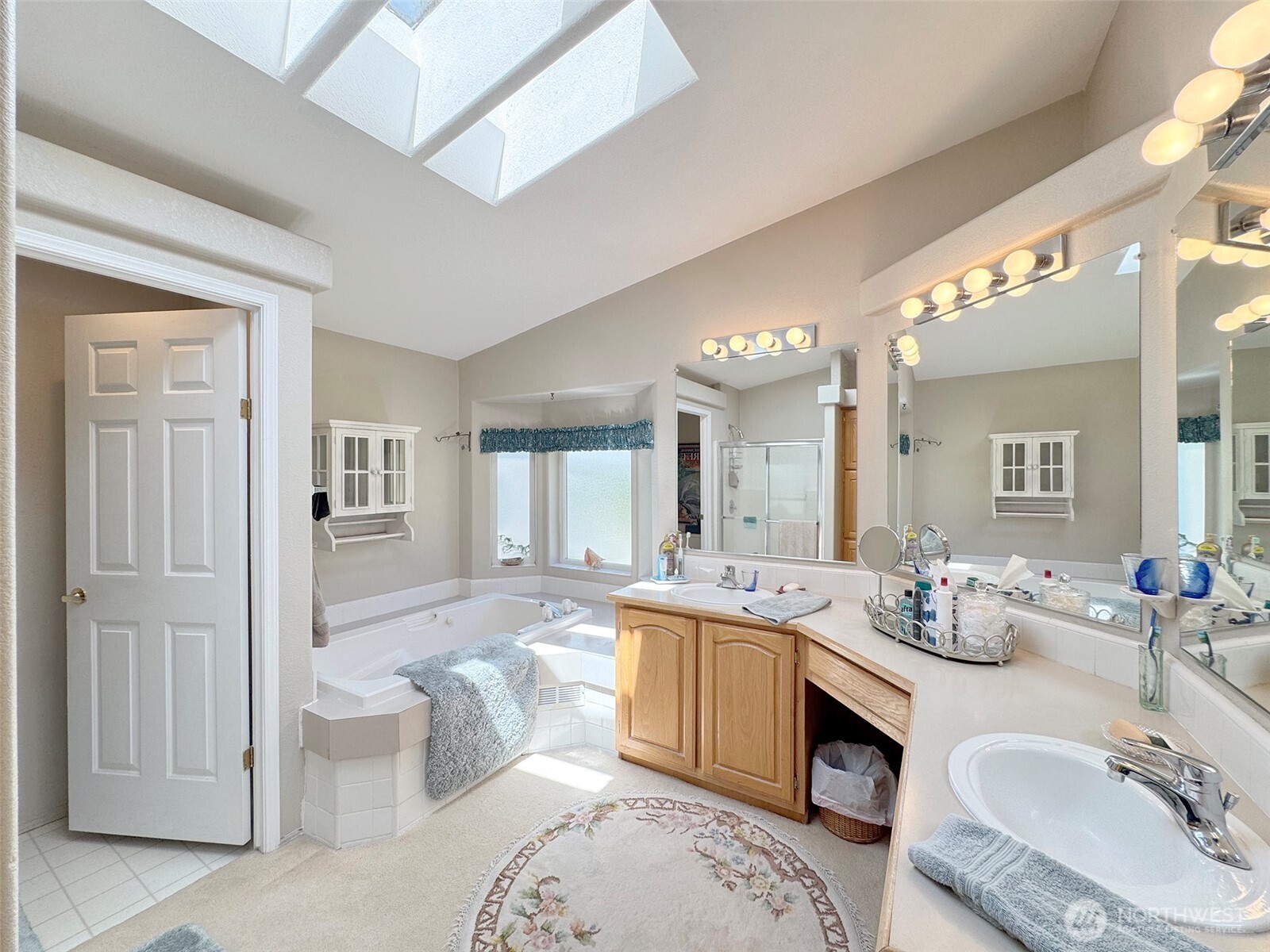 77 Rd Less Traveled Way Sequim, WA 98382 - Photo 29 of 40 a spacious bathroom with a sink a toilet and a tub