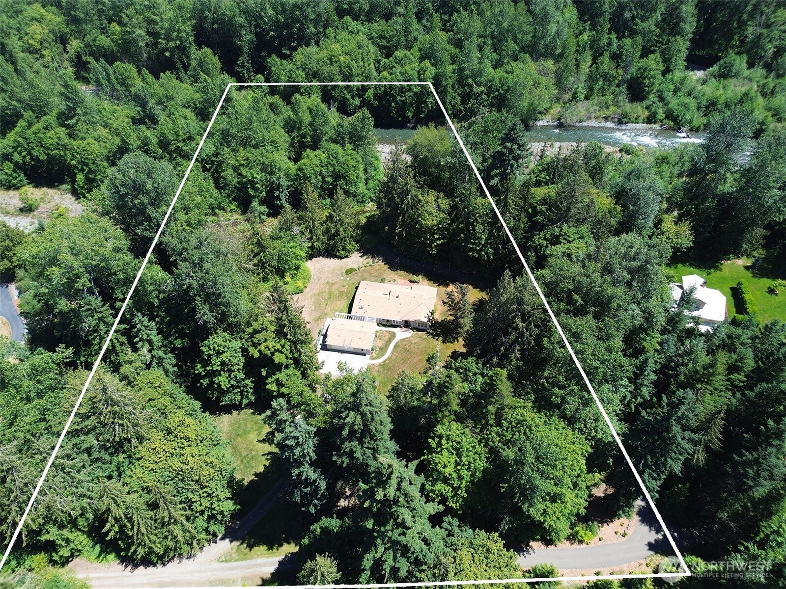 77 Rd Less Traveled Way Sequim, WA 98382 - Photo 36 of 40 an aerial view of a house with a yard