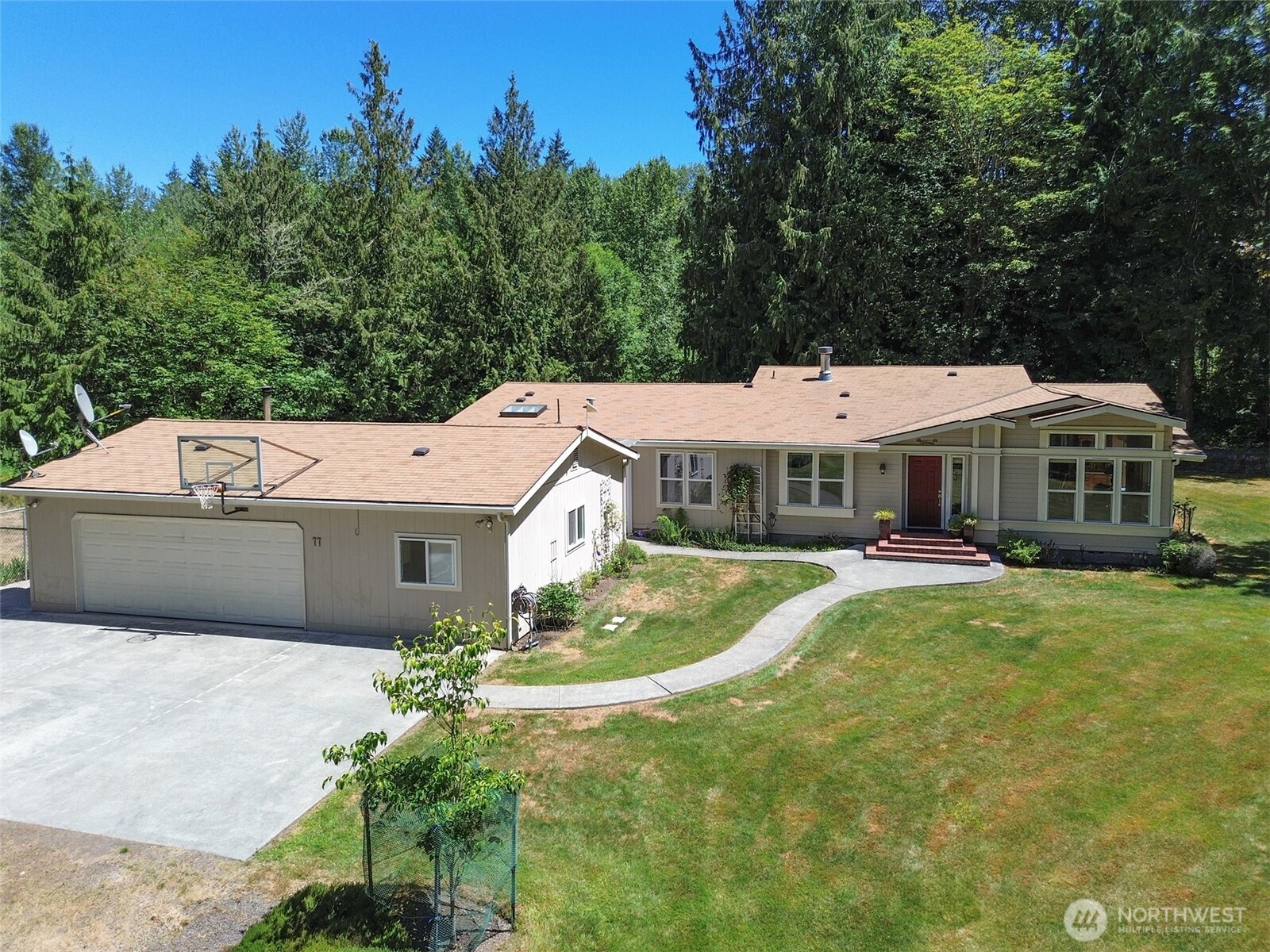 77 Rd Less Traveled Way Sequim, WA 98382 - Photo 37 of 40 a aerial view of a house with swimming pool in front of it