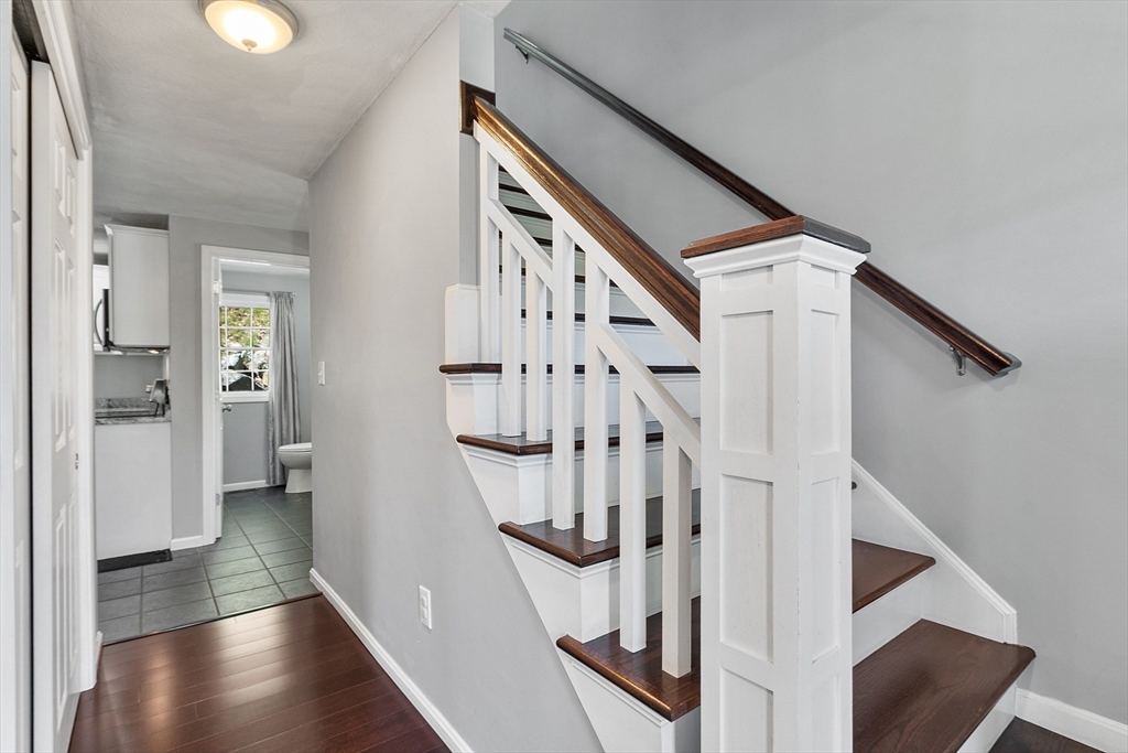 10 Station Road Salem, MA 01970 - Photo 12 of 37 a view of entryway with wooden floor and stairs