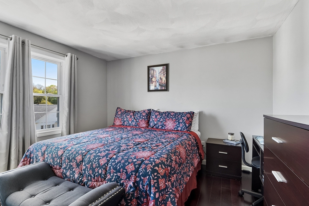 10 Station Road Salem, MA 01970 - Photo 16 of 37 a bedroom with a bed and wooden floor