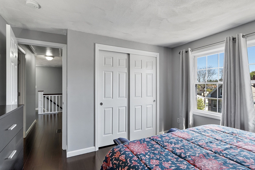 10 Station Road Salem, MA 01970 - Photo 17 of 37 a bedroom with a bed and a window