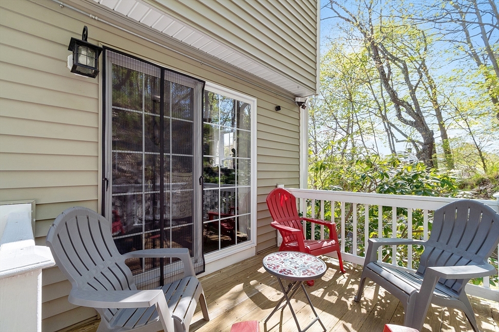 10 Station Road Salem, MA 01970 - Photo 26 of 37 a view of a balcony with chairs and potted plants