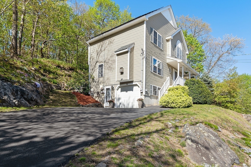 10 Station Road Salem, MA 01970 - Photo 34 of 37 a front view of a house with a yard