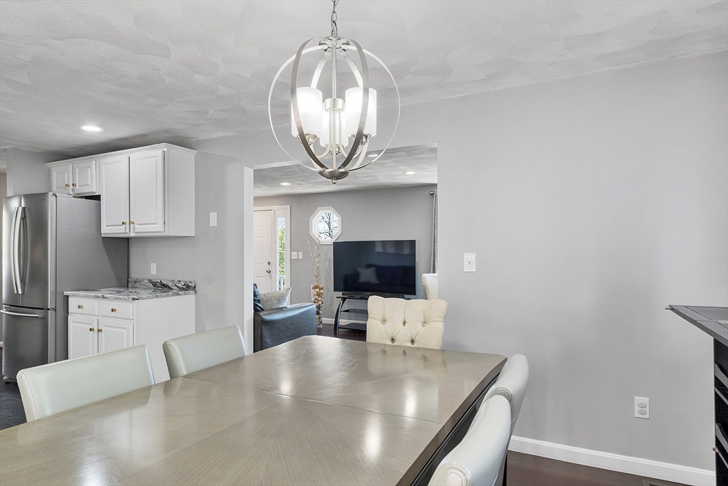 10 Station Road Salem, MA 01970 - Photo 6 of 37 a large kitchen with stainless steel appliances a large counter top and a stove
