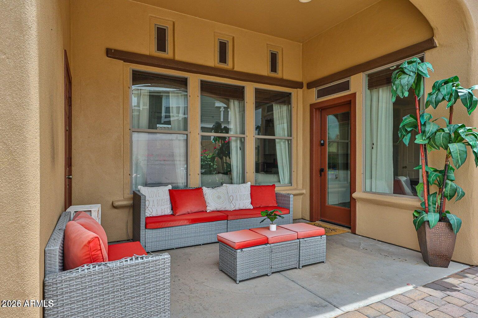 3950 North Edith Way Buckeye, AZ 85396 - Photo 28 of 32 a outdoor living space with furniture and a potted plant