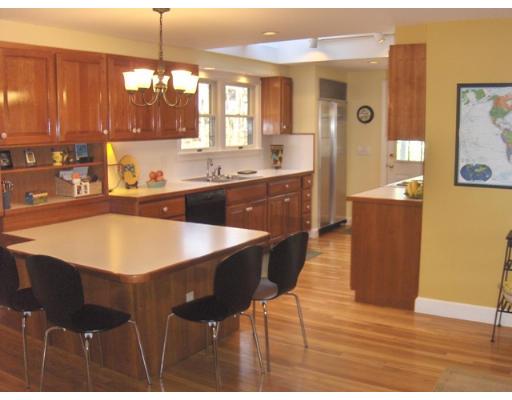 21 Washington Street Lexington, MA 02421 - Photo 7 of 21 a large kitchen with kitchen island a counter space a sink appliances and cabinets