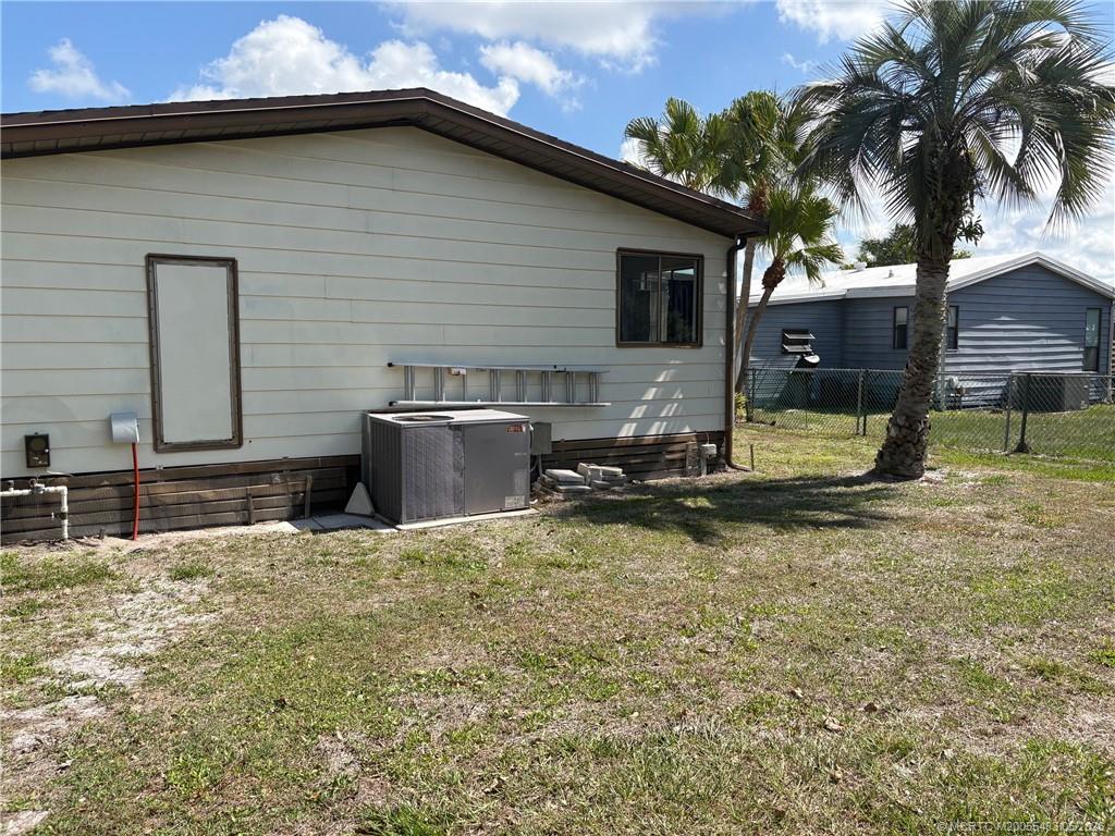 2856 Southwest Toronado Trail Stuart, FL 34997 - Photo 20 of 20 a view of a house with backyard and sitting area
