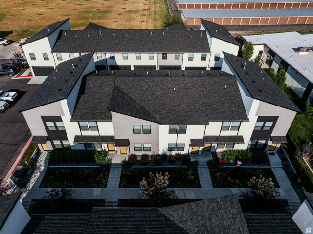 220 Spring Creek Parkway Providence, UT 84332 - Photo 15 of 26 Modern multi-level townhomes featuring dark asphalt shingle roofing and light-toned siding