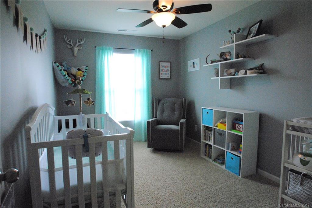 9203 Yellow Oak Road Charlotte, NC 28227 - Photo 12 of 17 a living room with furniture and a book shelf