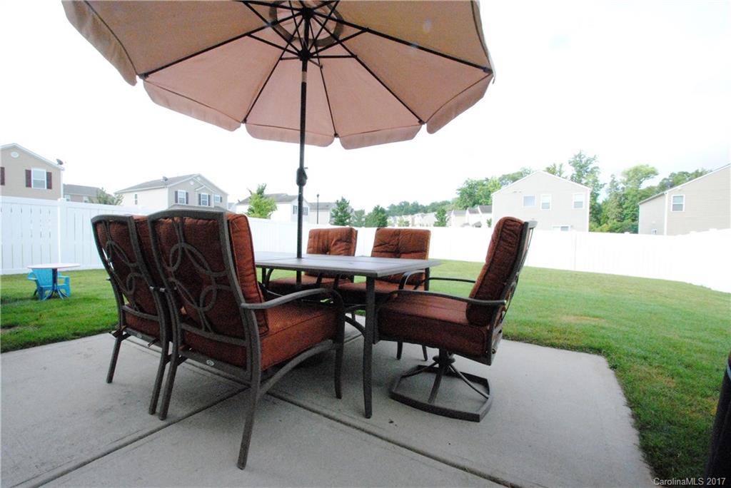 9203 Yellow Oak Road Charlotte, NC 28227 - Photo 14 of 17 a view of a chairs and table in the yard