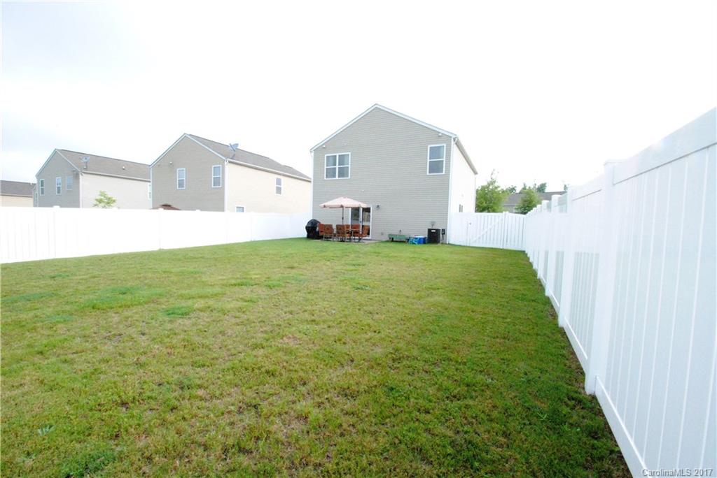 9203 Yellow Oak Road Charlotte, NC 28227 - Photo 15 of 17 a view of a house with a yard