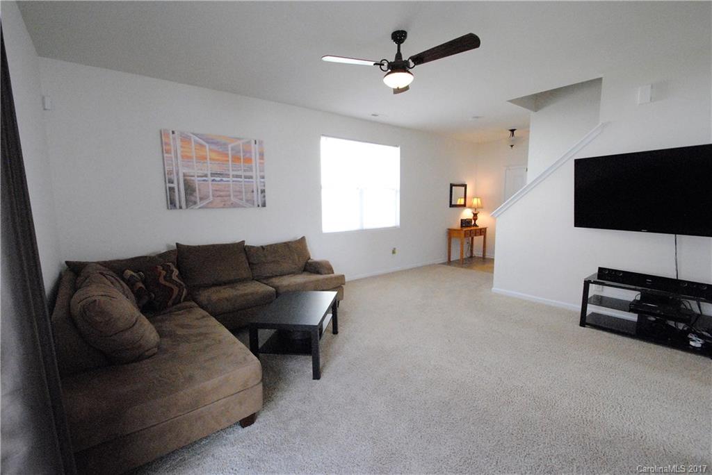 9203 Yellow Oak Road Charlotte, NC 28227 - Photo 3 of 17 a living room with furniture and a flat screen tv