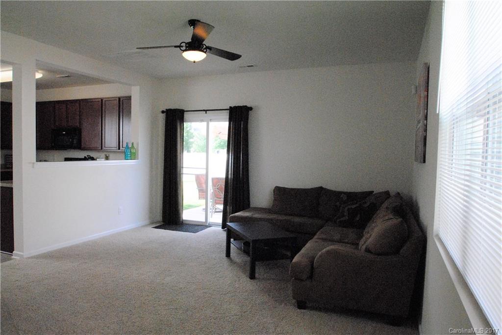9203 Yellow Oak Road Charlotte, NC 28227 - Photo 4 of 17 a living room with furniture and a flat screen tv
