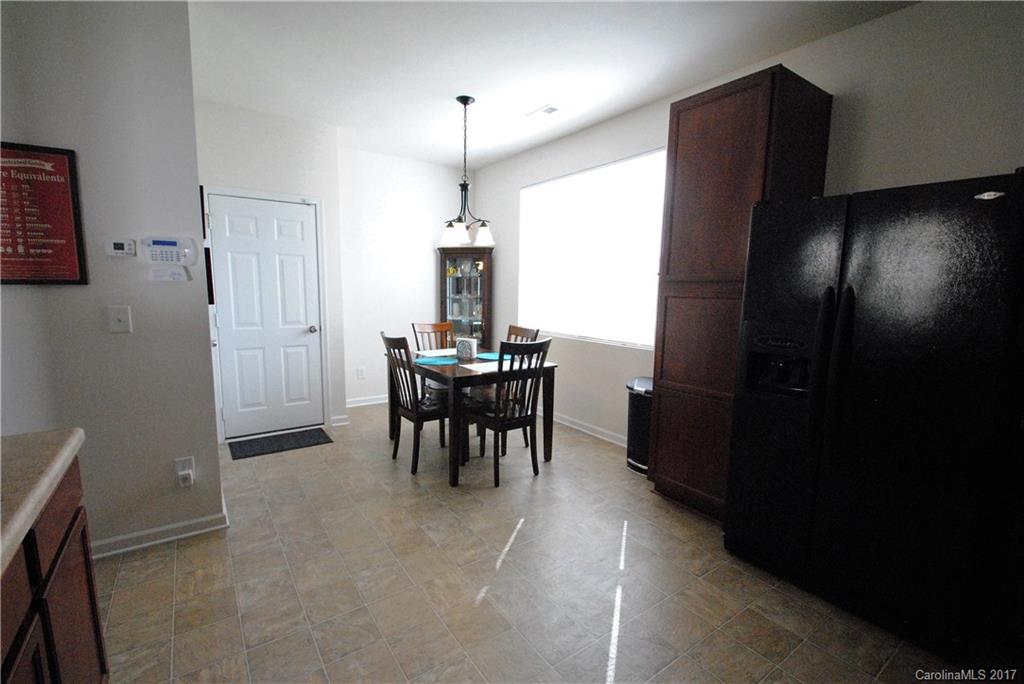 9203 Yellow Oak Road Charlotte, NC 28227 - Photo 6 of 17 a view of a room with kitchen and dining area