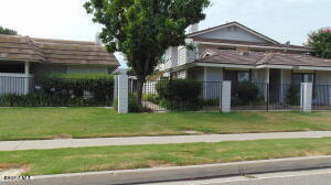 2388 Royal Avenue, Unit 26 Simi Valley, CA 93065 - Photo 1 of 11 a view of a house with a yard