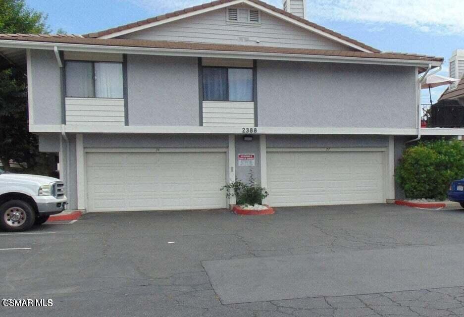2388 Royal Avenue, Unit 26 Simi Valley, CA 93065 - Photo 11 of 11 a front view of a house with parking space