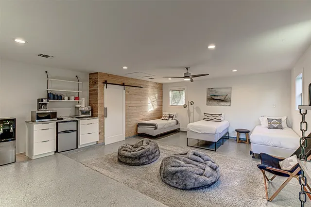 an aerial view of a houses with a yard